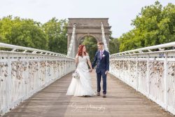 nottingham welbeck house wedding photography bride groom walking over white river trent bridge